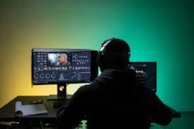 man in front of a computer