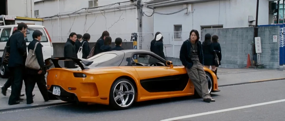 Original Tokyo Drift scene with Han leaning on orange RX-7