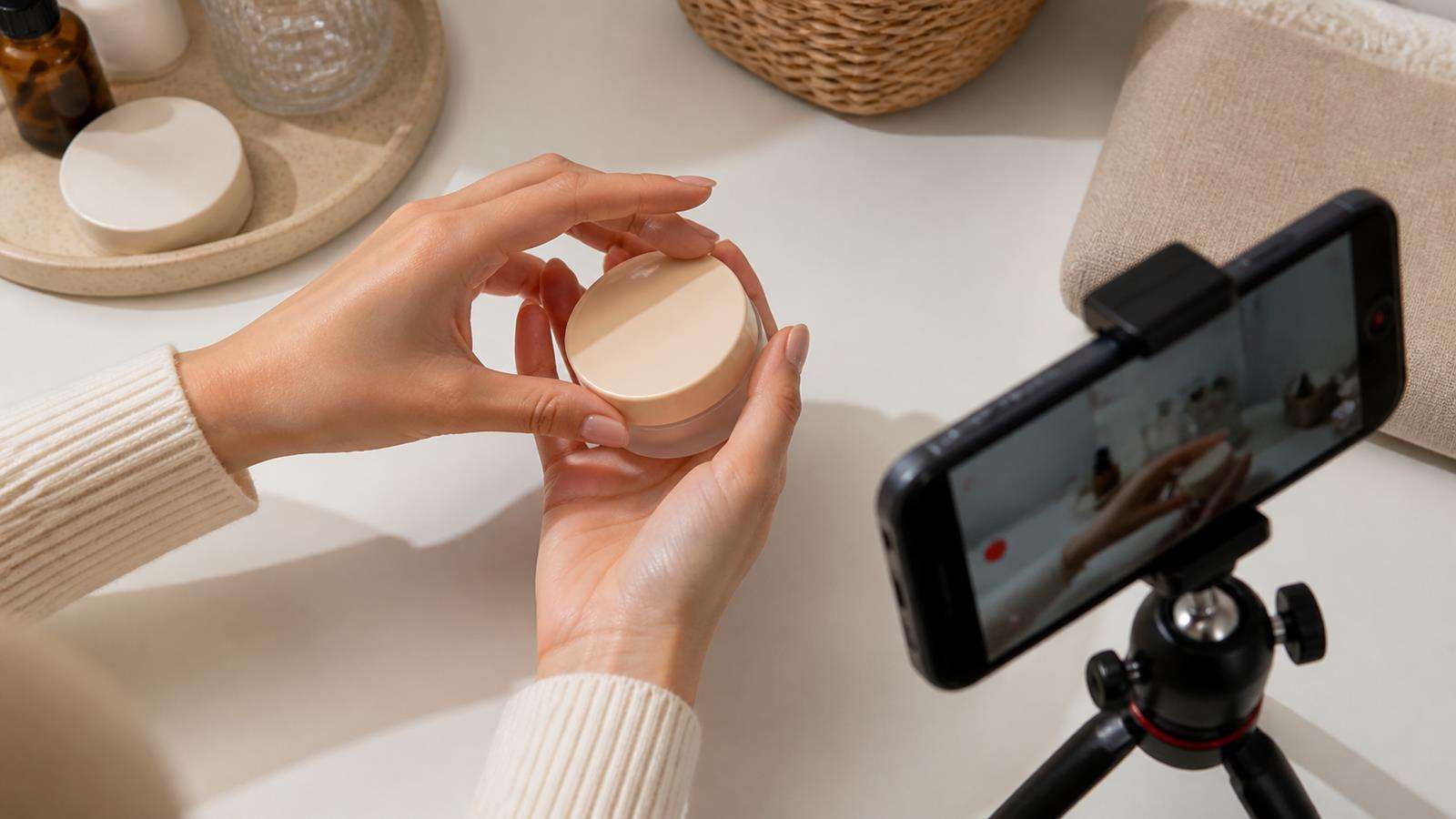 A realistic macro UGC frame showing correct fingertip contact, palm contact shadow, product scale, and a clear three-quarter camera angle