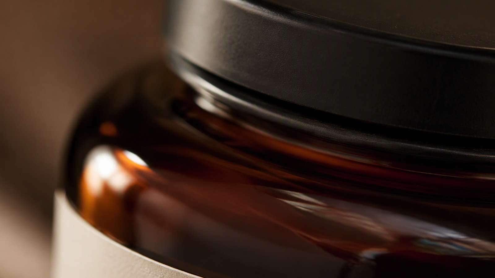 Generated close detail of the fictional product's glass, closure, and label material