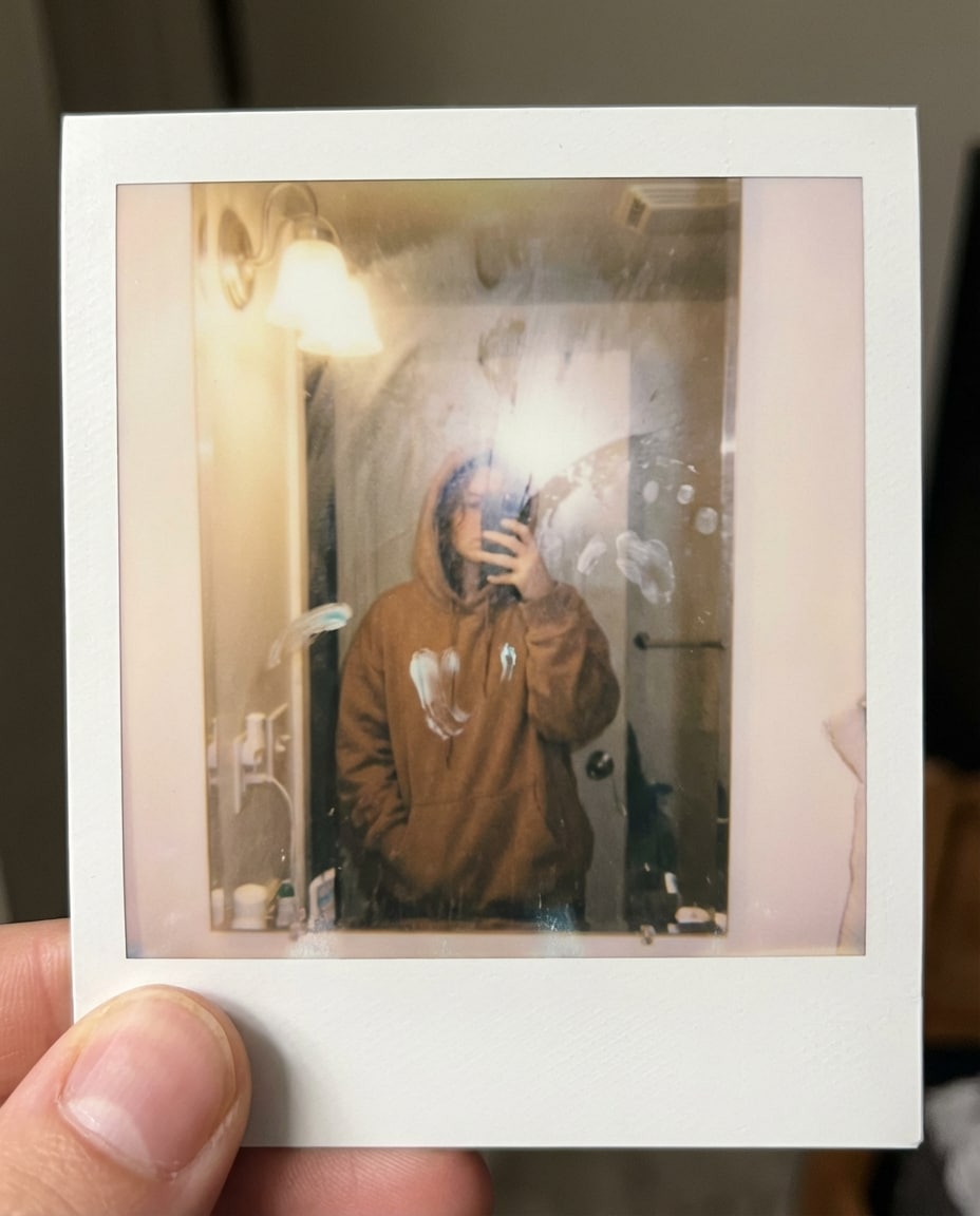 polaroid bathroom mirror photo
