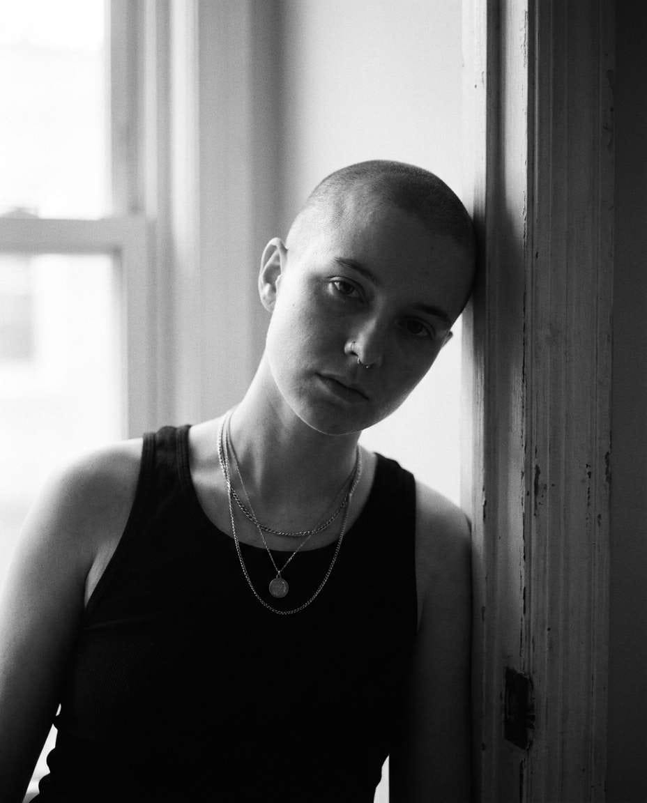 leaning on doorframe photo