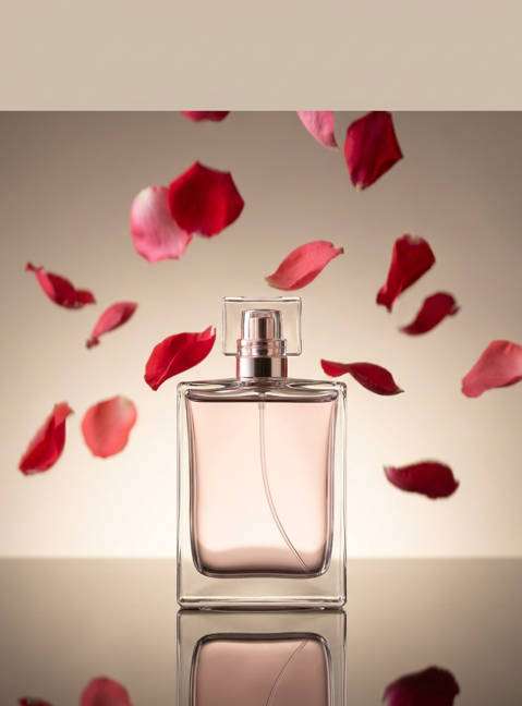 petals falling around bottle photo