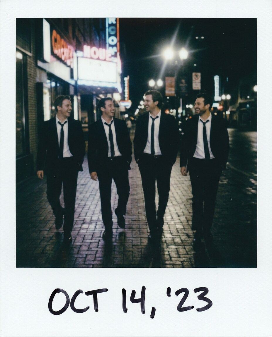 groomsmen sidewalk snap photo