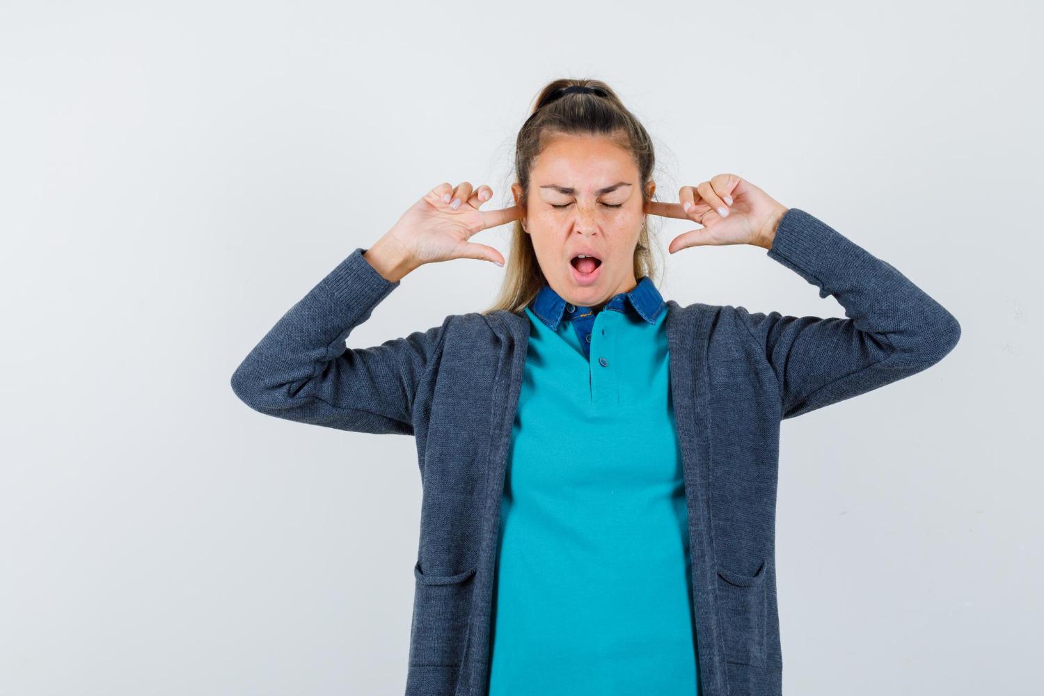 woman distracted by hiss and hum
