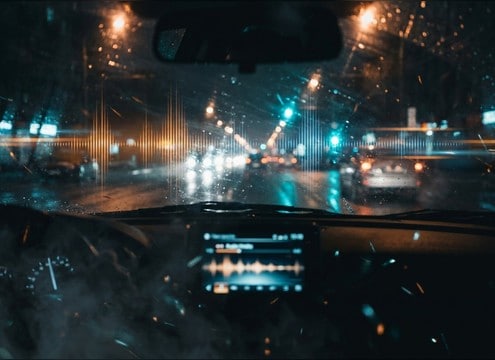 Dashcam style video scene needing car pass-by and horn audio