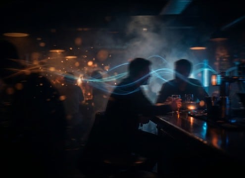Bar ambience under dialogue with low masking room tone