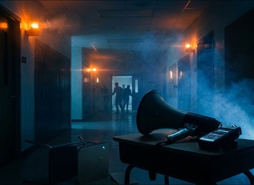 Bullhorn announcement sound for an emergency drill in a hallway