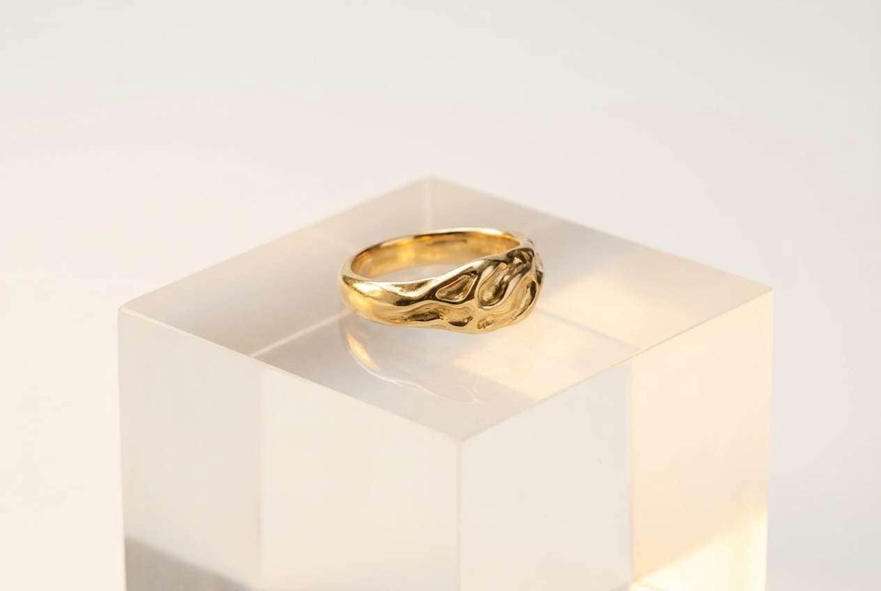 gold ring on pedestal