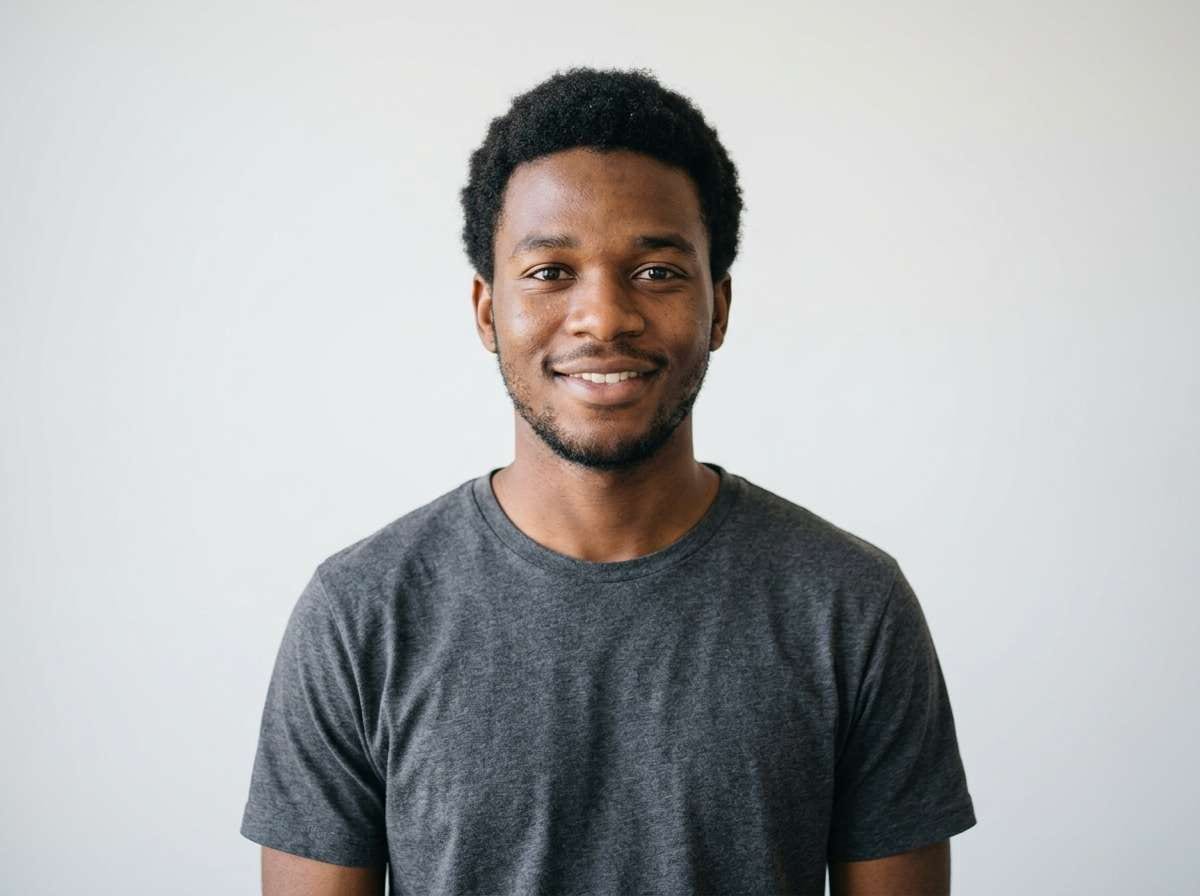 before - man with short natural hair, plain background, no dreadlocks