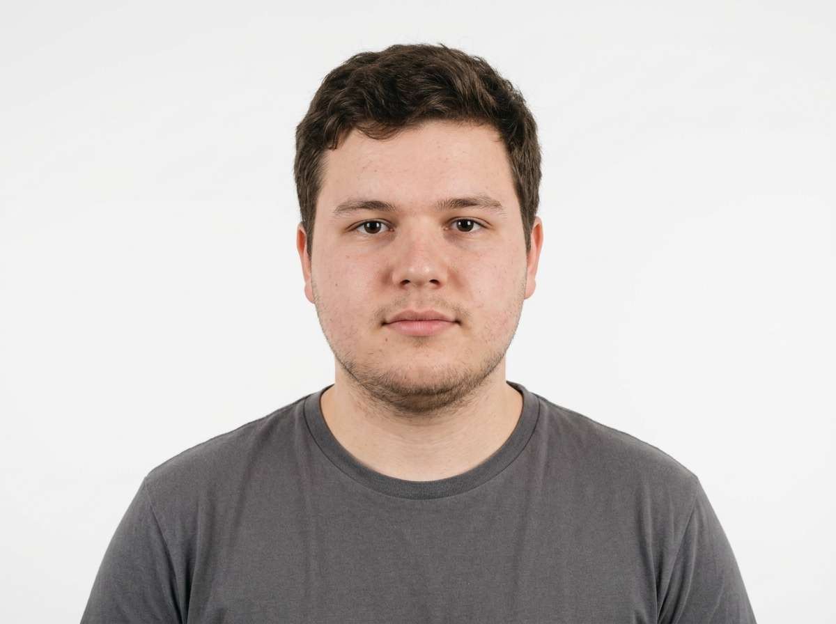 before - man portrait with soft facial features, studio lighting, professional headshot